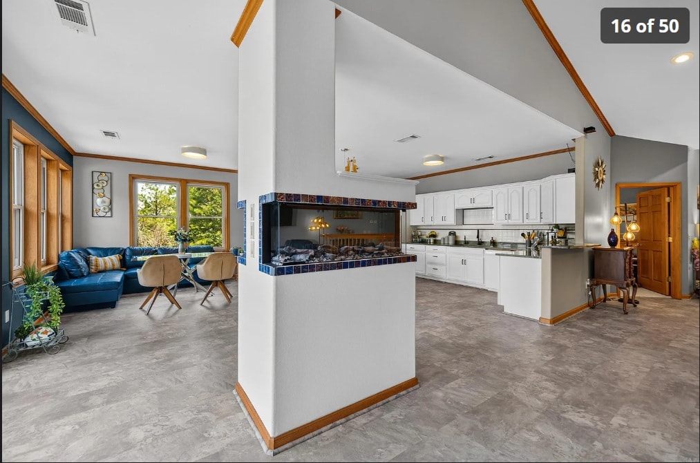 Living room with decorative blue-tile fireplace — 139 Waterfront Ct