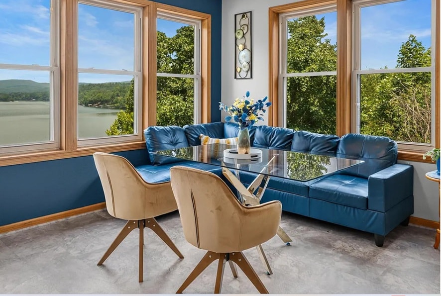 Kitchen from dining area — open layout with island seating and water views at 139 Waterfront Ct