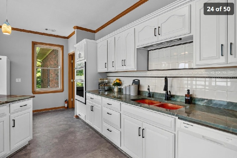 Kitchen counter detail — granite surfaces, custom cabinetry, and designer fixtures at 139 Waterfront Ct